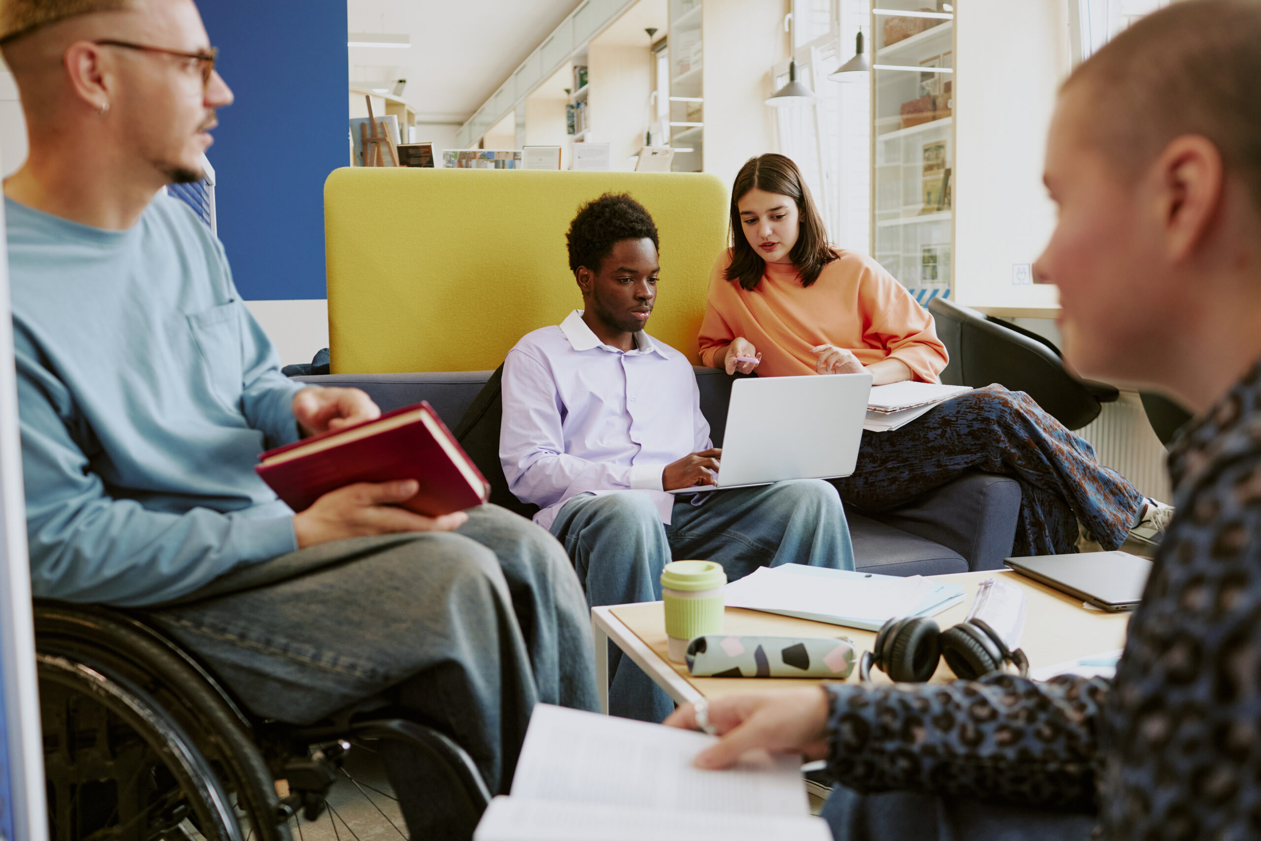 Collaborating in Modern Office Space with Diverse Team